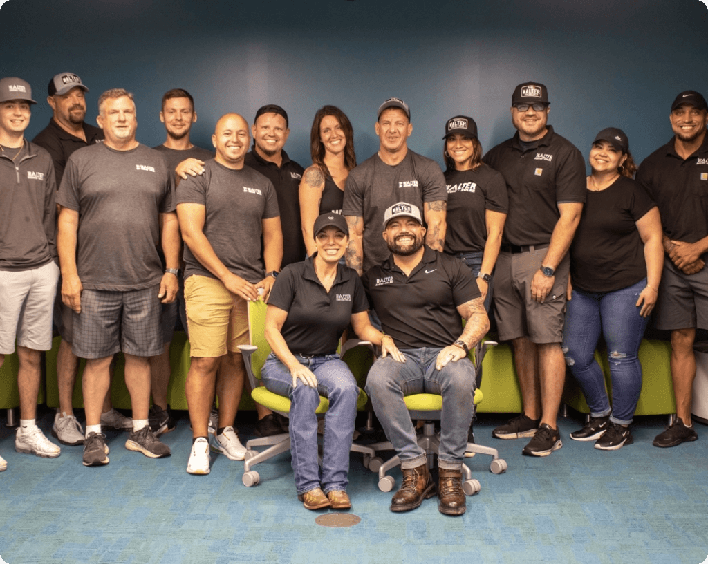 Walter Roofing + Solar team stands together in uniform for group photo